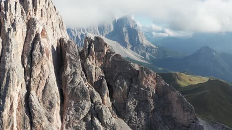 Aerial-of-Becco-Di-Mezzodi-mountain-peak-revealing-Monte-Pelmo-in-clouds