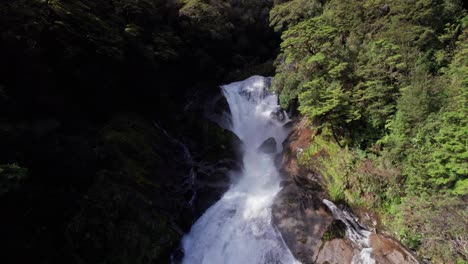 Aerial-flying-towards-Roaring-Billy-Falls-2-in-Haast,-West-Coast,-New-Zealand