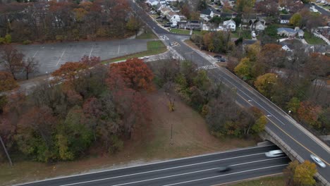 An-aerial-time-lapse-of-a-highway-on-a-cloudy-day-on-Long-Island,-NY