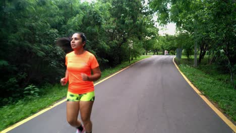 Hispanic-woman-running-in-the-park