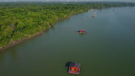 Drone-View-of-floating-house-on-Bagan-Lalang-river,-Sepang,-Selangor,-Malaysia