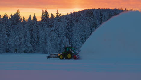 Norbotten-tractor-snow-blower-preparing-ice-drifting-race-woodland-trail-at-sunrise