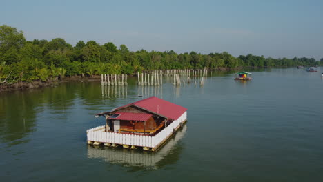 Aerial-drone-View-of-floating-house-on-Bagan-Lalang-river,-Sepang,-Malaysia