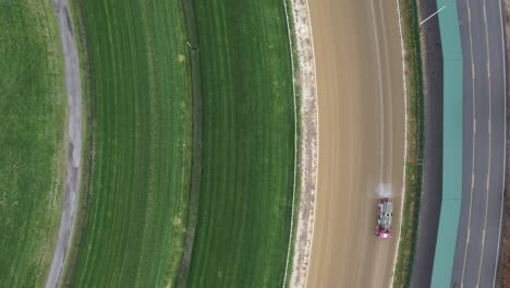 An-aerial-view-of-a-horse-race-track-on-a-cloudy-day,-while-it-was-closed-for-renovations