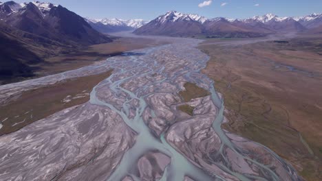 aerial-flying-over-the-braided-Godley-river-looking-towards-the-snow-capped-mountains-close-to-lake-tekapo-in-Canterbury-New-Zealand-part-2