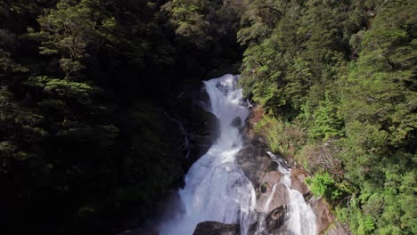 Aerial-flying-towards-Roaring-Billy-Falls-in-Haast,-West-Coast,-New-Zealand