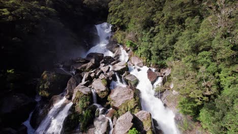 Aerial-getting-closer-to-Roaring-Billy-Falls-in-Haast,-West-Coast,-New-Zealand