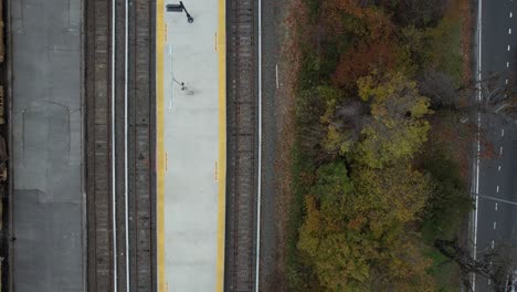 A-top-down-view-of-a-train-station-with-a-construction-train-on-the-track