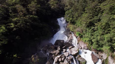 Aerial-slows-ascending-Roaring-Billy-Falls-in-Haast,-West-Coast,-New-Zealand