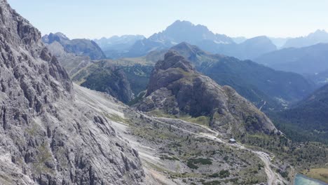 High-altitude-mountain-pass-in-Italian-Dolomites,-aerial-mountain-landscape-with-Valparola-Pass