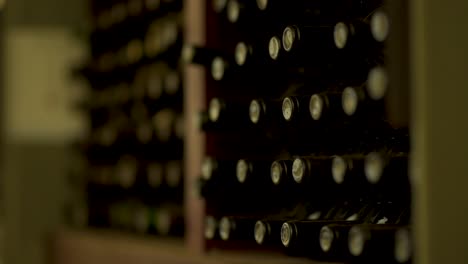 Racks-of-a-wine-cellar-containing-many-bottles