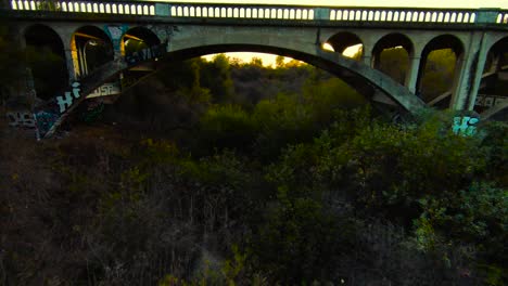 Flying-under-Historic-San-Luis-Rey-Bridge-at-sunset