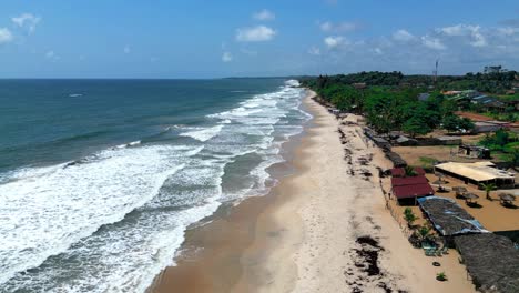 Ariel-view-of-waves-on-the-beach-in-San-Pedro,-Côte-d'Ivoire,-West-Africa