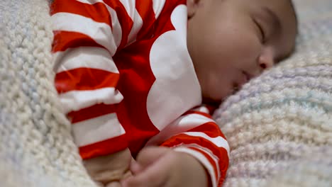 Close-Up-Of-Adorable-2-Month-Old-Baby-Sleeping-On-Blanket