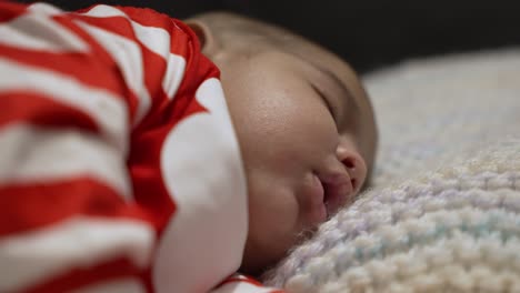 Close-Up-Of-Adorable-2-Month-Old-Indian-Baby-Sleeping-On-Blanket