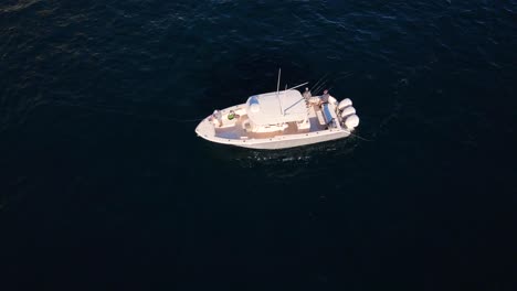 Drone-view-of-sport-fishing-boat-rocking-back-and-fourth