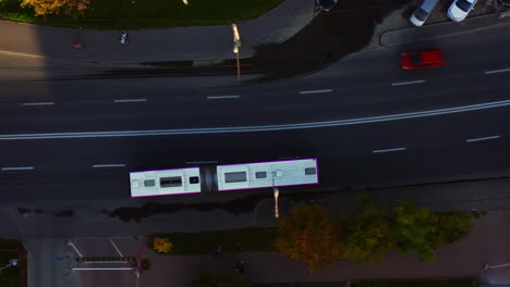 Establishing-Aerial-drone-shot-top-down-view-of-a-bus,-Cluj-Napoca,-Iulius-Mall-zone