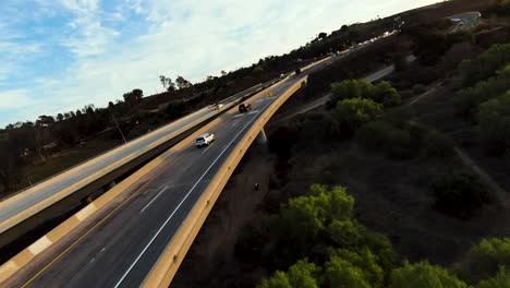 Flying-low-to-San-Luis-Rey-Bridge-following-cars