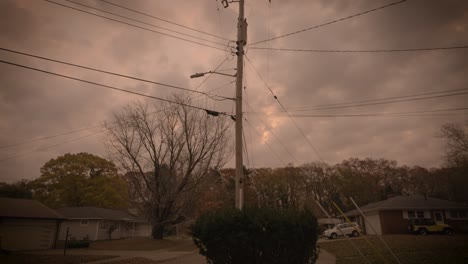 A-telephone-pole-in-the-center-of-a-dreary-orange-sky-before-an-intense-Autumn-Storm