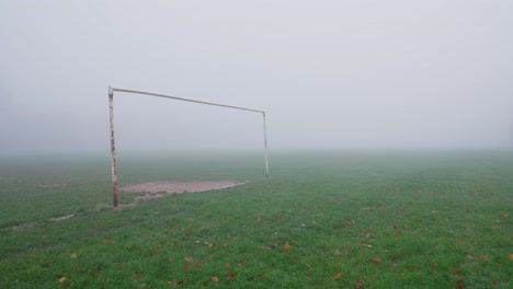 A-rusty-goalpost-on-a-foggy-football-field-during-autumn