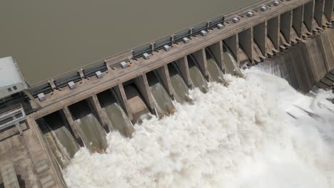Aerial-view-of-hydro-electric-dam-releasing-turbid-flood-water