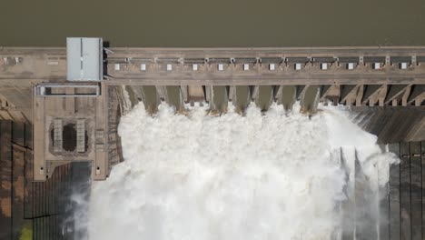 Aerial-rises-slowly-from-dramatic-hydro-dam-releasing-flood-water