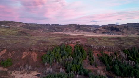 Pink-Sunrise-Over-Reykjadalur-Valley-In-South-Iceland---aerial-drone-shot