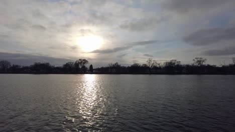 Calm-river-with-sun-through-the-clouds