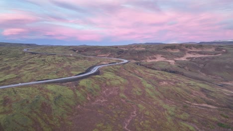 Landscape-Of-Hellisheidi-During-Pink-Sunrise-In-Iceland---aerial-drone-shot