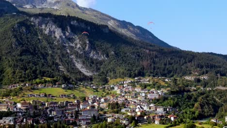 Aerial-views-of-the-Molveno-town-and-lake,-in-the-Dolomites-region,-Trento,-Italy