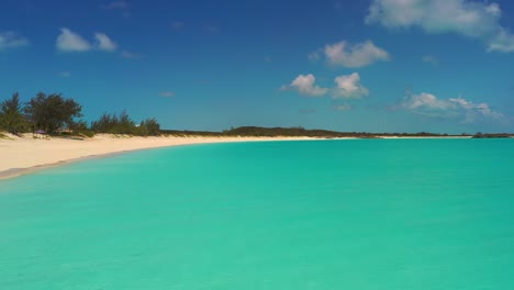 Drone-along-Tropic-of-Cancer-Beach,-Exuma,-Bahamas