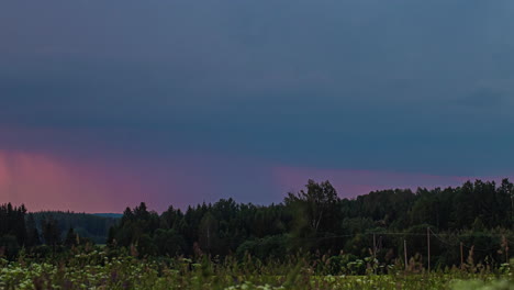 A-dramatic-lightning-and-thunderstorm-in-the-dark-sky-over-the-forest---time-lapse