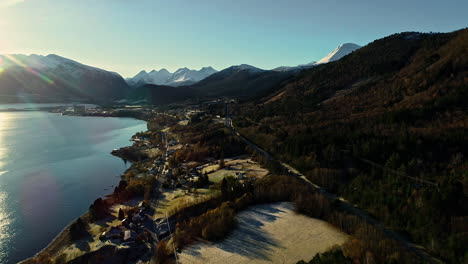 A-village-alongside-a-fjord-in-the-Scandinavian-countryside---aerial-flyover