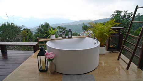 outdoor-bath-tub-with-beautiful-mountain-hill-view-background