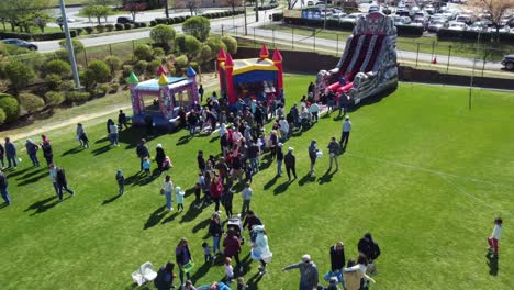 Kids-playing-on-inflatable,-bouncy-house-at-Spring-Fest-in-Winston-Salem,-NC