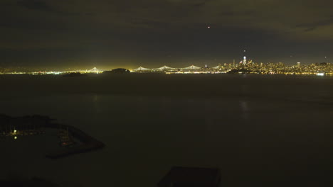 Time-lapse-of-downtown-San-Fransisco-from-over-the-waters-of-the-Pacific-Ocean-with-the-Oakland-Bay-Bridge-in-the-background-located-in-California