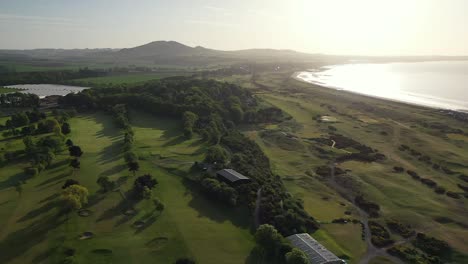 Aerial-Drone-View-of-Parkland-Golf-Course-in-Scotland-at-Sunrise