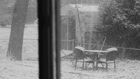 Snow-falling-heavily-on-a-suburban-yard-in-Michigan