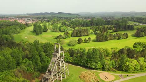 Aerial-Pan-Around-Monument-in-Lochore-Meadows-to-Reveal-Golf-Course-Behind