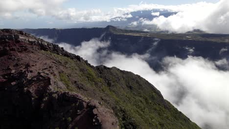 A-fly-over-the-mountains-and-clouds-in-Reunion-Island,-France
