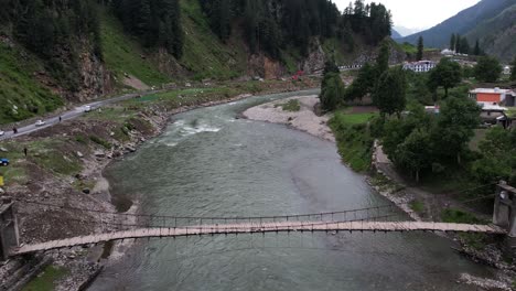 aerial-suspension-bridge-on-the-river-kunhar,-naran-kaghan-valley,-KPK-pakistan