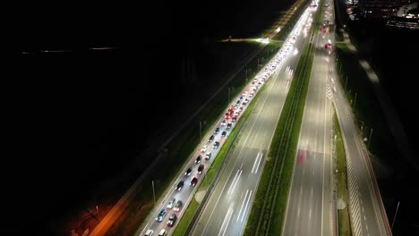 Hyperlapse-or-Dronelapse-Aerial-view-of-Highway-road-next-to-City-Warsaw,-Wilanow