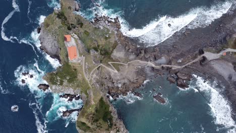 famous-gaztelugatxe-in-the-basque-country-in-northern-spain-at-the-atlantic-ocean,-filmed-by-drone-from-above