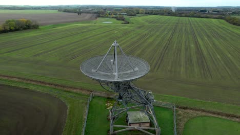 Aerial-view-reveal-over-Mullard-MRAO-radio-observatory-telescope-array-on-Cambridge-countryside