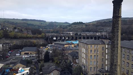 Aerial-drone-view-of-the-village-of-Slaithwaite,-Slawit,-a-industrial-town-in-West-Yorkshire,-UK
