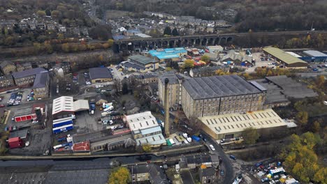 Aerial-drone-view-of-the-village-of-Slaithwaite,-Slawit,-a-industrial-town-in-West-Yorkshire,-UK