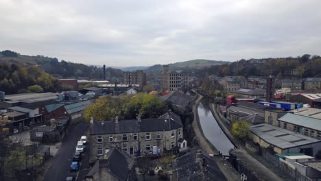 Aerial-drone-view-of-the-village-of-Slaithwaite,-Slawit,-an-industrial-town-in-West-Yorkshire,-UK