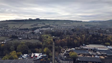 Aerial,-drone-view-of-the-village-of-Slaithwaite,-Slawit,-a-industrial-town-in-West-Yorkshire,-UK