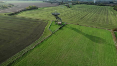 Mullard-MRAO-radio-telescope-dish-on-Cambridge-farmland-with-long-sunset-shadow-aerial-view
