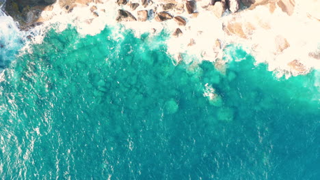 Aerial-shot-of-ocean-coast-with-views-of-waves-and-cliffs
